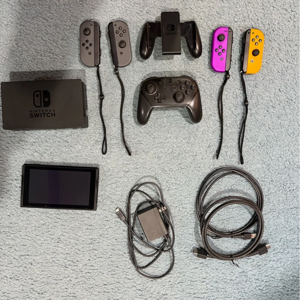Nintendo Switch with Gray, Purple, and Orange Joy-Con Controllers